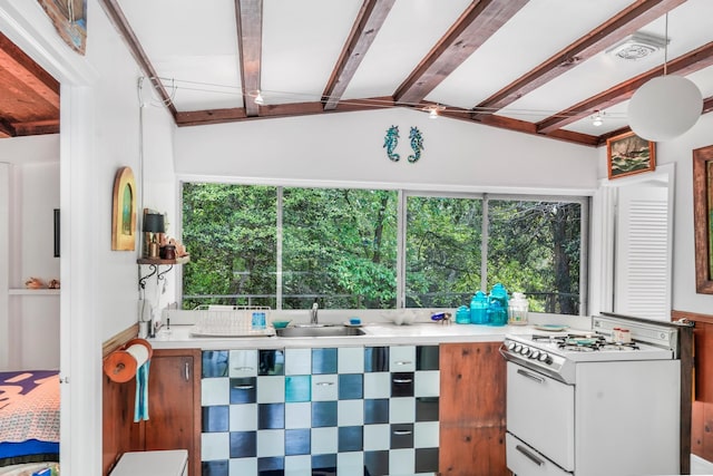 284 Bay Walk, Fire Island Pines, NY 11782 - kitchen featuring white gas range and light countertops