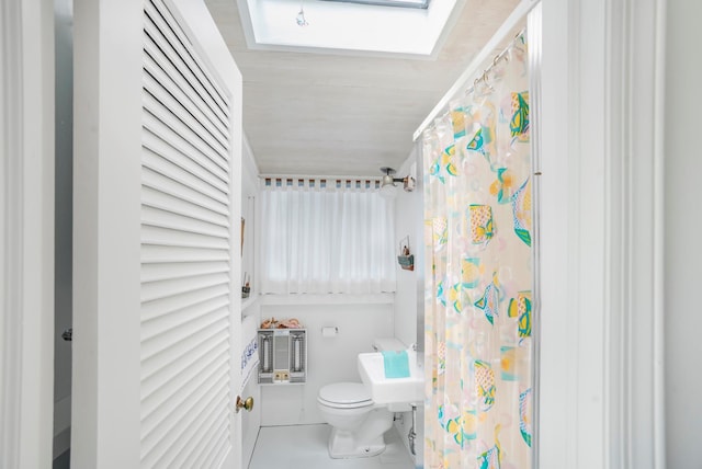 284 Bay Walk, Fire Island Pines, NY 11782 - bathroom featuring a skylight, curtained shower, and tile patterned flooring