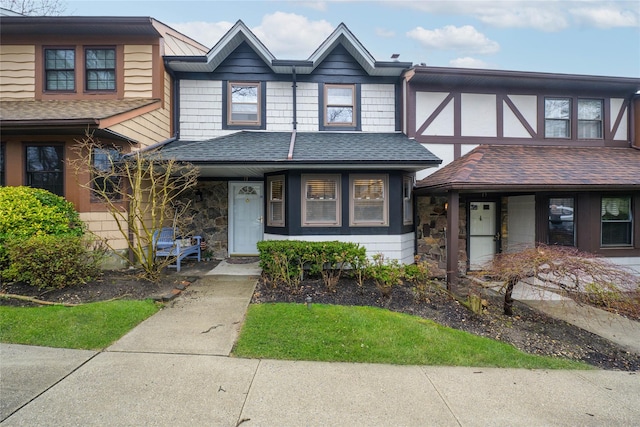 17 Sheffield Hl Unit 105, Woodbury, NY 11797 - townhome / multi-family property featuring a shingled roof, a porch, and stone siding