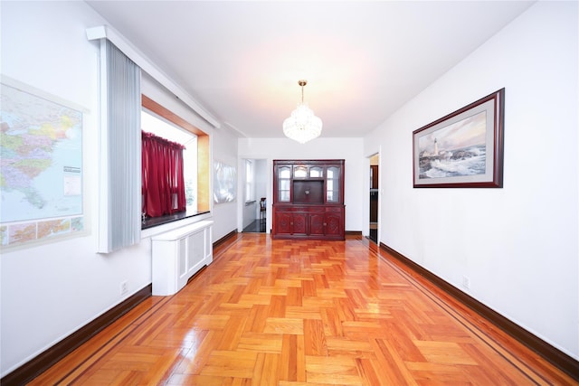 95-15 243rd St, Floral Park, NY 11001 - hallway featuring a chandelier, baseboards, and plenty of natural light
