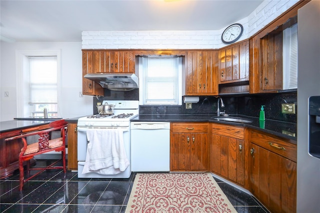 95-15 243rd St, Floral Park, NY 11001 - kitchen with white appliances, a sink, under cabinet range hood, tasteful backsplash, and dark countertops