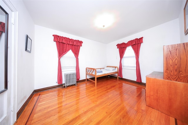 95-15 243rd St, Floral Park, NY 11001 - unfurnished bedroom featuring radiator heating unit and wood finished floors