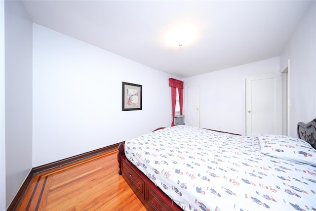 95-15 243rd St, Floral Park, NY 11001 - bedroom with light wood-style flooring and baseboards