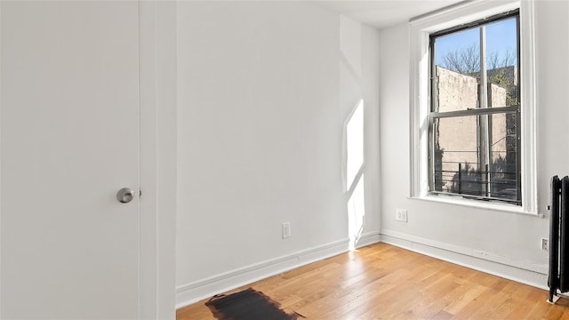 1037 College Ave, Bronx, NY 10456 - empty room with light wood-style floors and baseboards