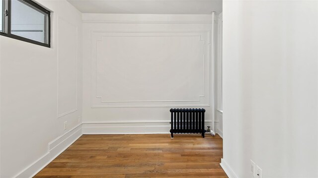 1037 College Ave, Bronx, NY 10456 - detailed view of radiator heating unit and wood finished floors
