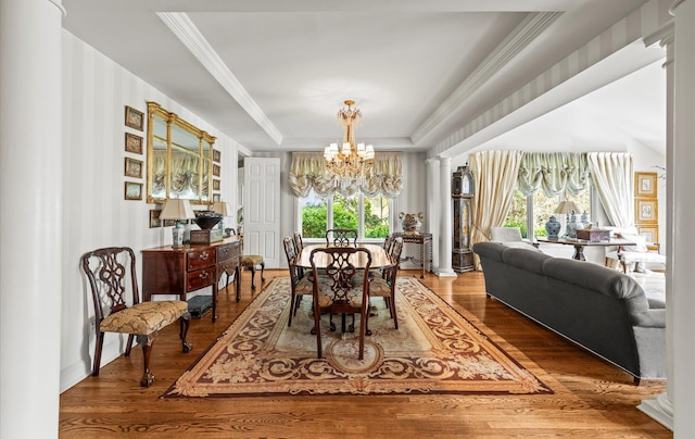 5 Hickory Ct, Manhasset, NY 11030 - dining space featuring a chandelier, a tray ceiling, wood finished floors, and crown molding