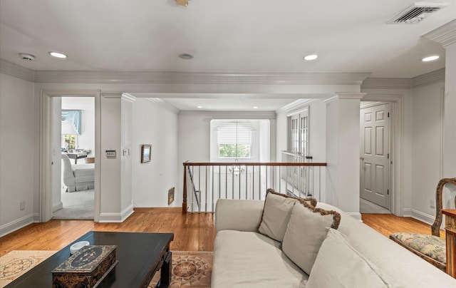 5 Hickory Ct, Manhasset, NY 11030 - living room featuring light wood-style flooring, crown molding, baseboards, decorative columns, and recessed lighting