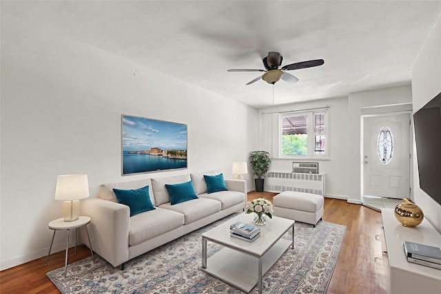1327 E 84th St, Brooklyn, NY 11236 - living area with a ceiling fan, wood finished floors, and baseboards
