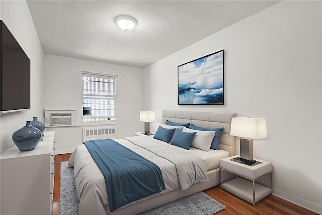 1327 E 84th St, Brooklyn, NY 11236 - bedroom featuring radiator heating unit, wood finished floors, baseboards, and a wall mounted AC