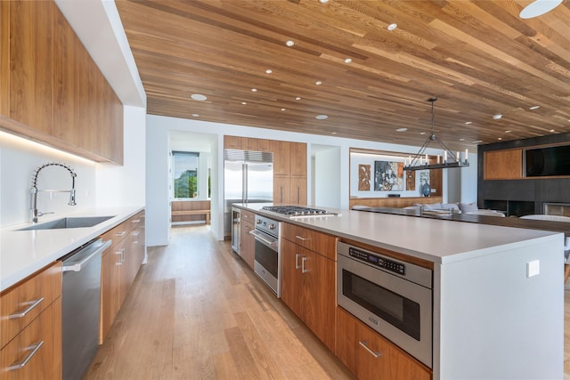 470 Lloyds Ln, Mattituck, NY 11952 - kitchen featuring modern cabinets, built in appliances, wood ceiling, a chandelier, and recessed lighting
