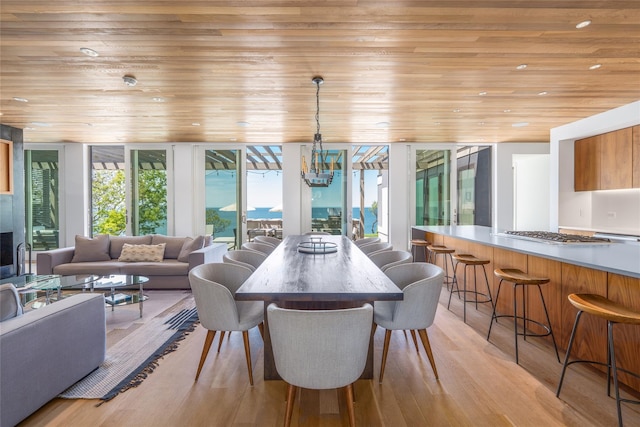 470 Lloyds Ln, Mattituck, NY 11952 - dining area featuring wood ceiling, light wood-type flooring, recessed lighting, floor to ceiling windows, and a chandelier