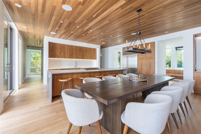 470 Lloyds Ln, Mattituck, NY 11952 - dining space featuring light wood-type flooring, recessed lighting, and wood ceiling