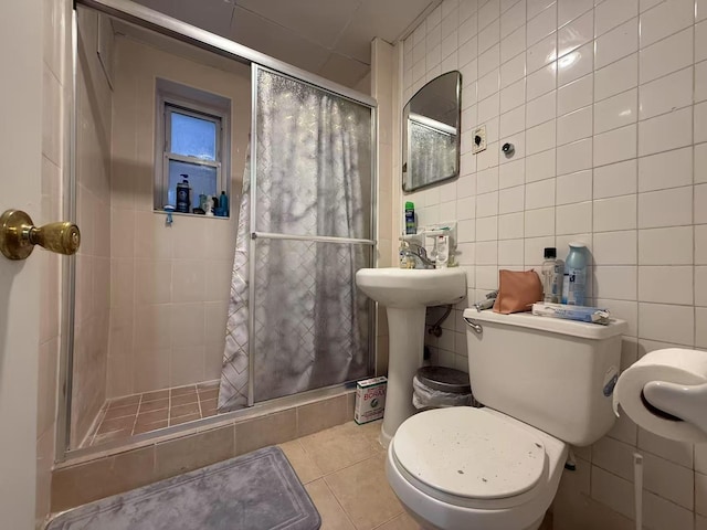 51-21 Goldsmith St, Elmhurst, NY 11373 - bathroom with a stall shower, tile walls, tile patterned floors, and toilet