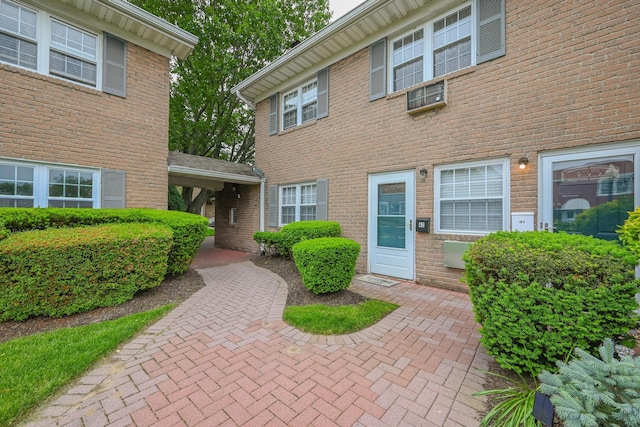 42 Springwood Dr, North Babylon, NY 11703 - view of exterior entry with brick siding