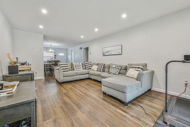 42 Springwood Dr, North Babylon, NY 11703 - living room with wood finished floors, recessed lighting, baseboards, and a chandelier