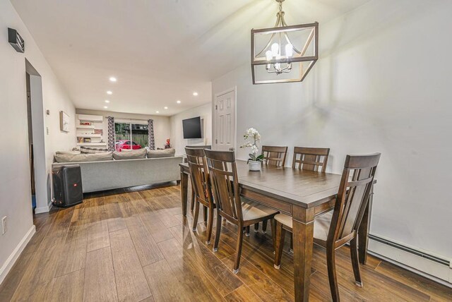 42 Springwood Dr, North Babylon, NY 11703 - dining room featuring baseboard heating, a chandelier, wood finished floors, recessed lighting, and baseboards