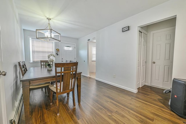 42 Springwood Dr, North Babylon, NY 11703 - dining room with a chandelier, a baseboard radiator, dark wood finished floors, and baseboards