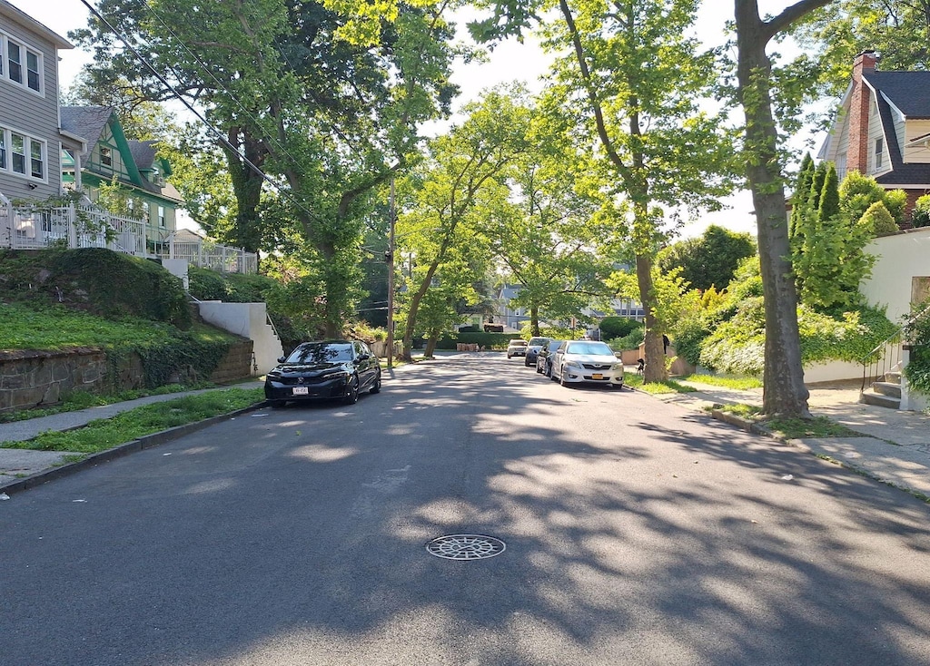 26 Amsterdam Pl, Mount Vernon, NY 10553 - view of asphalt road with sidewalks, a residential view, and curbs