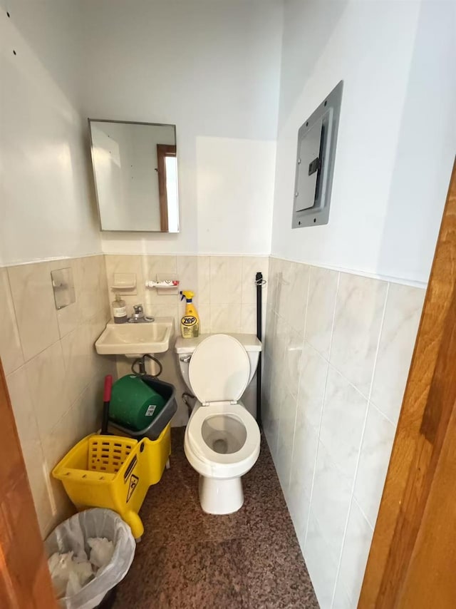41-09 Forley St, Elmhurst, NY 11373 - half bath featuring tile walls, wainscoting, and electric panel