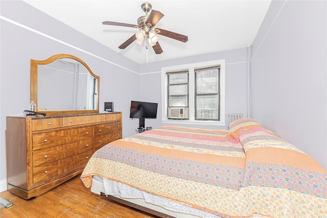 2187 Holland Ave Unit 2J, Bronx, NY 10462 - bedroom with wood finished floors, a ceiling fan, and cooling unit