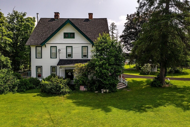 482 Scotchtown Ave, Middletown, NY 10941 - view of front facade with a front lawn, a shingled roof, a chimney, and covered porch