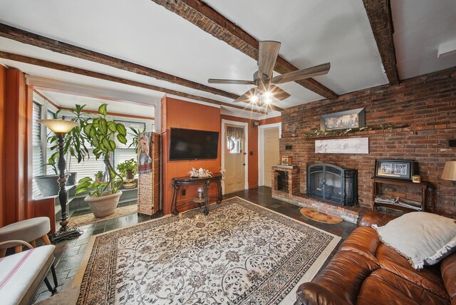 482 Scotchtown Ave, Middletown, NY 10941 - living room with ceiling fan, stone tile floors, a brick fireplace, and beam ceiling