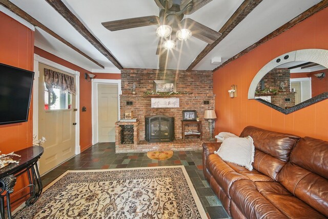 482 Scotchtown Ave, Middletown, NY 10941 - living area featuring ceiling fan, beamed ceiling, stone tile floors, and a fireplace