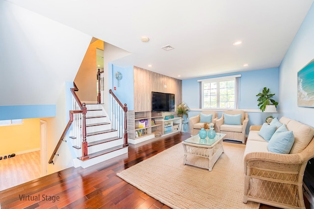 151 Birch Dr, Manhasset Hills, NY 11040 - living area with dark wood-style floors, stairs, and recessed lighting