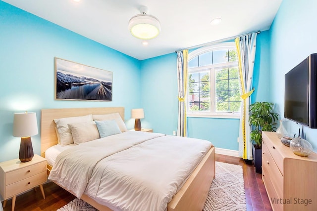 151 Birch Dr, Manhasset Hills, NY 11040 - bedroom with dark wood-style floors and recessed lighting