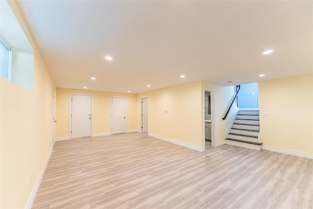 151 Birch Dr, Manhasset Hills, NY 11040 - below grade area with recessed lighting, light wood-style floors, and stairs