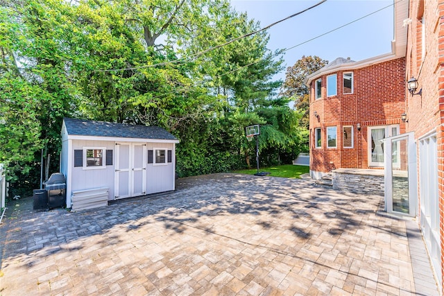 151 Birch Dr, Manhasset Hills, NY 11040 - view of patio / terrace with a shed