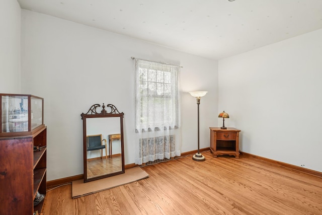 54 Ogden Ave, East Williston, NY 11596 - spare room featuring wood finished floors and baseboards