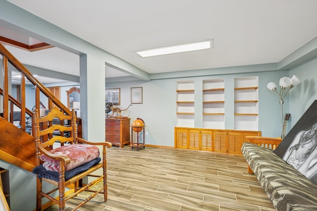 54 Ogden Ave, East Williston, NY 11596 - living room featuring wood finished floors, baseboards, and stairs