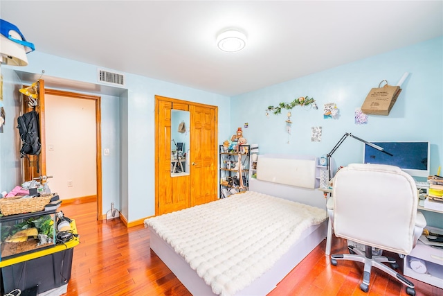 145-04 21st Ave, Whitestone, NY 11357 - bedroom with light wood-style flooring and a closet