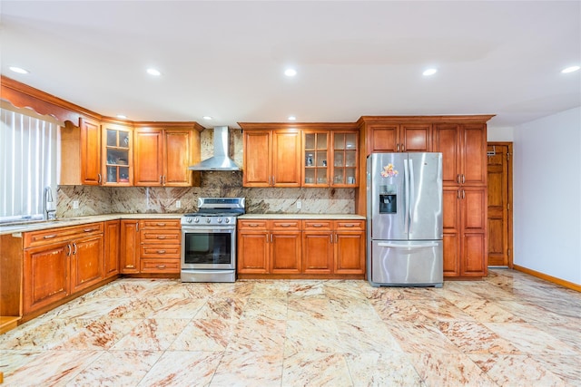 145-04 21st Ave, Whitestone, NY 11357 - kitchen with appliances with stainless steel finishes, wall chimney exhaust hood, brown cabinets, decorative backsplash, and recessed lighting