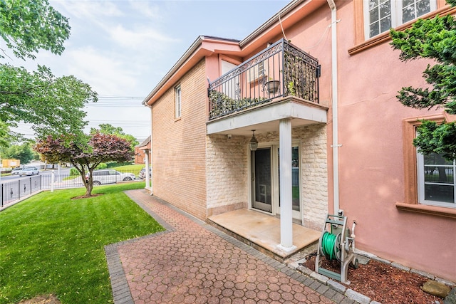 145-04 21st Ave, Whitestone, NY 11357 - rear view of house featuring a balcony, a patio, and stucco siding