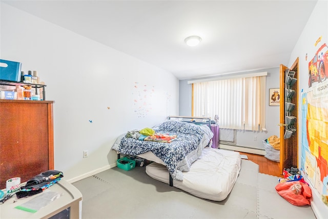145-04 21st Ave, Whitestone, NY 11357 - bedroom with a baseboard heating unit and baseboards