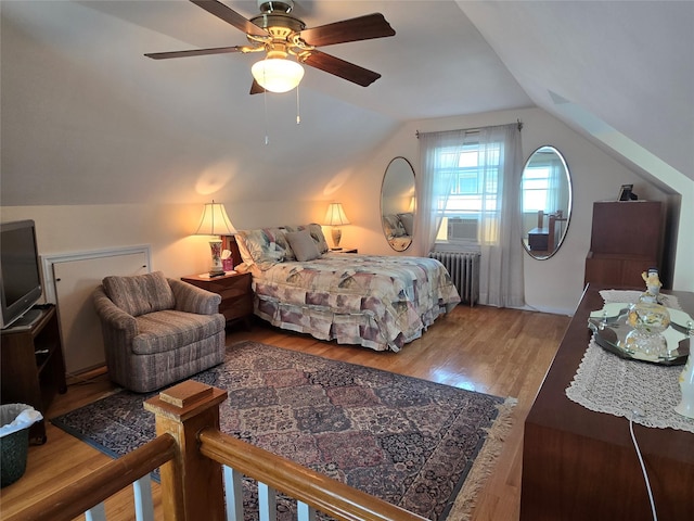 29 Irving St, Valley Stream, NY 11580 - bedroom featuring radiator, lofted ceiling, wood finished floors, and a ceiling fan