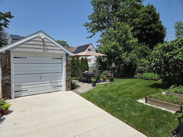 29 Irving St, Valley Stream, NY 11580 - view of green lawn with driveway, a vegetable garden, and a garage