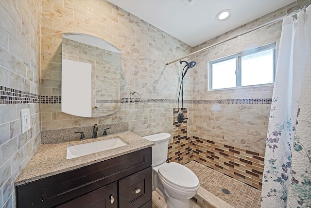 123 Baker Ct, Island Park, NY 11558 - full bath with tile walls, tiled shower, toilet, vanity, and recessed lighting