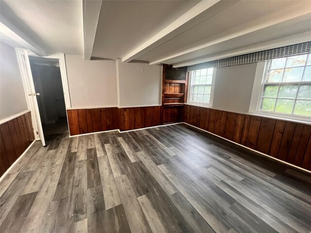27 Hooker Ave, Poughkeepsie, NY 12601 - spare room featuring a wainscoted wall, wood finished floors, wood walls, and beamed ceiling