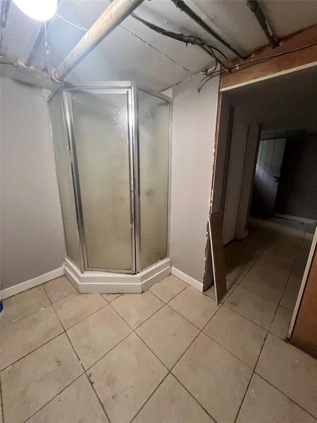 27 Hooker Ave, Poughkeepsie, NY 12601 - bathroom featuring a stall shower and tile patterned flooring