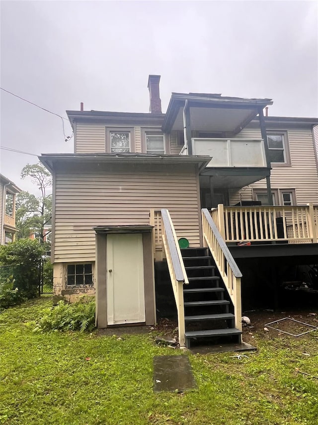 27 Hooker Ave, Poughkeepsie, NY 12601 - back of house featuring stairway, a chimney, and a wooden deck