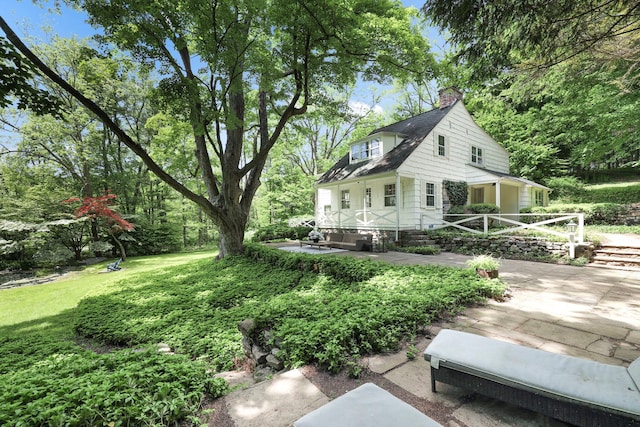 200 Millwood Rd, Chappaqua, NY 10514 - rear view of property featuring a patio, a chimney, and a yard