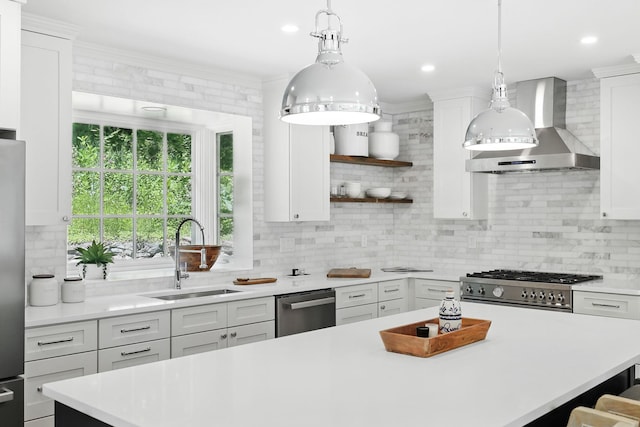 200 Millwood Rd, Chappaqua, NY 10514 - kitchen featuring wall chimney exhaust hood, a sink, dishwasher, light countertops, and range