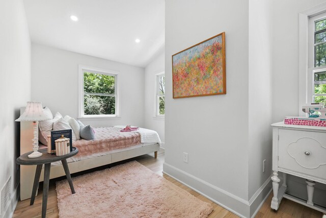 200 Millwood Rd, Chappaqua, NY 10514 - bedroom featuring multiple windows, recessed lighting, wood finished floors, baseboards, and lofted ceiling