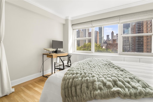 210 E 63rd St Unit 10E, New York Manhattan, NY 10065 - bedroom featuring light wood-style flooring, ornamental molding, and baseboards