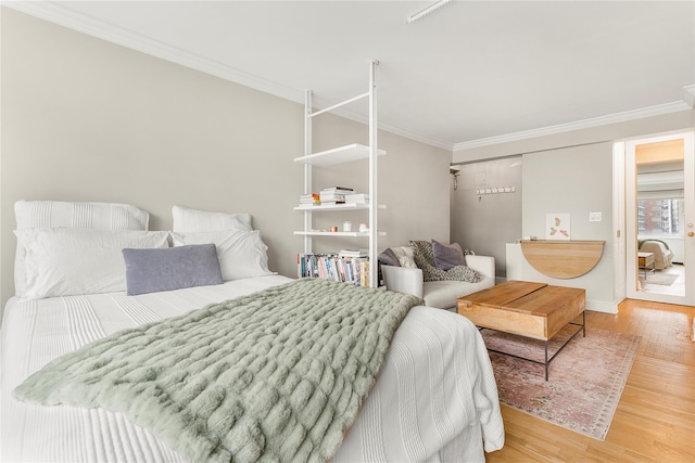 210 E 63rd St Unit 10E, New York Manhattan, NY 10065 - bedroom featuring crown molding, wood finished floors, and baseboards