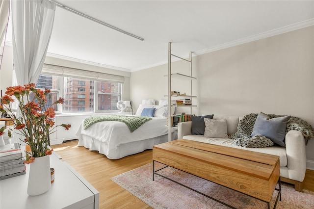210 E 63rd St Unit 10E, New York Manhattan, NY 10065 - bedroom with ornamental molding and light wood-type flooring