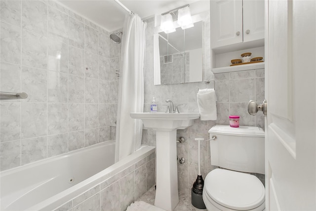 210 E 63rd St Unit 10E, New York Manhattan, NY 10065 - full bathroom featuring tiled shower / bath, toilet, and tile walls
